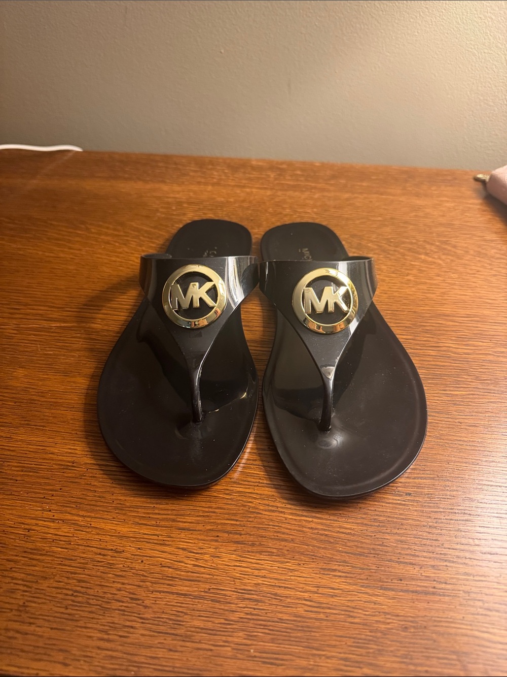 Michael Kors Black Flip Flop Sandals with Gold MK Medallion